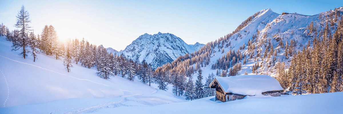 Chalet in the mountains surrounded by fresh powder